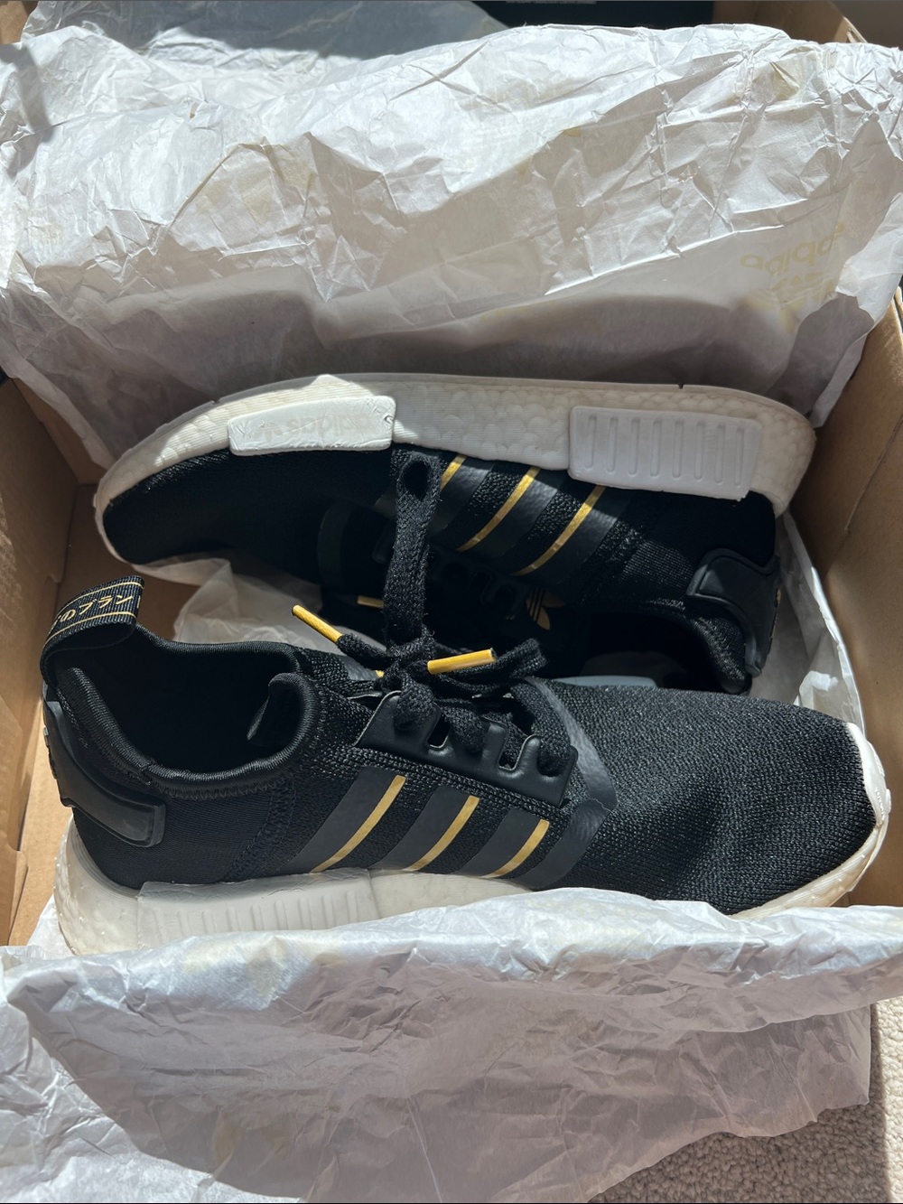 Adidas Black Sneakers with Gold Stripes